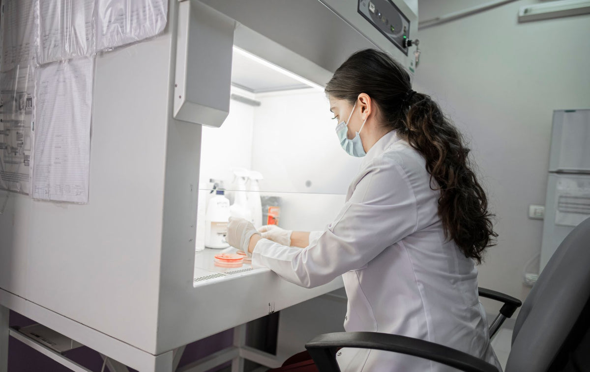 A female scientist wearing a mask works in a laboratory in Baku, Azerbaijan