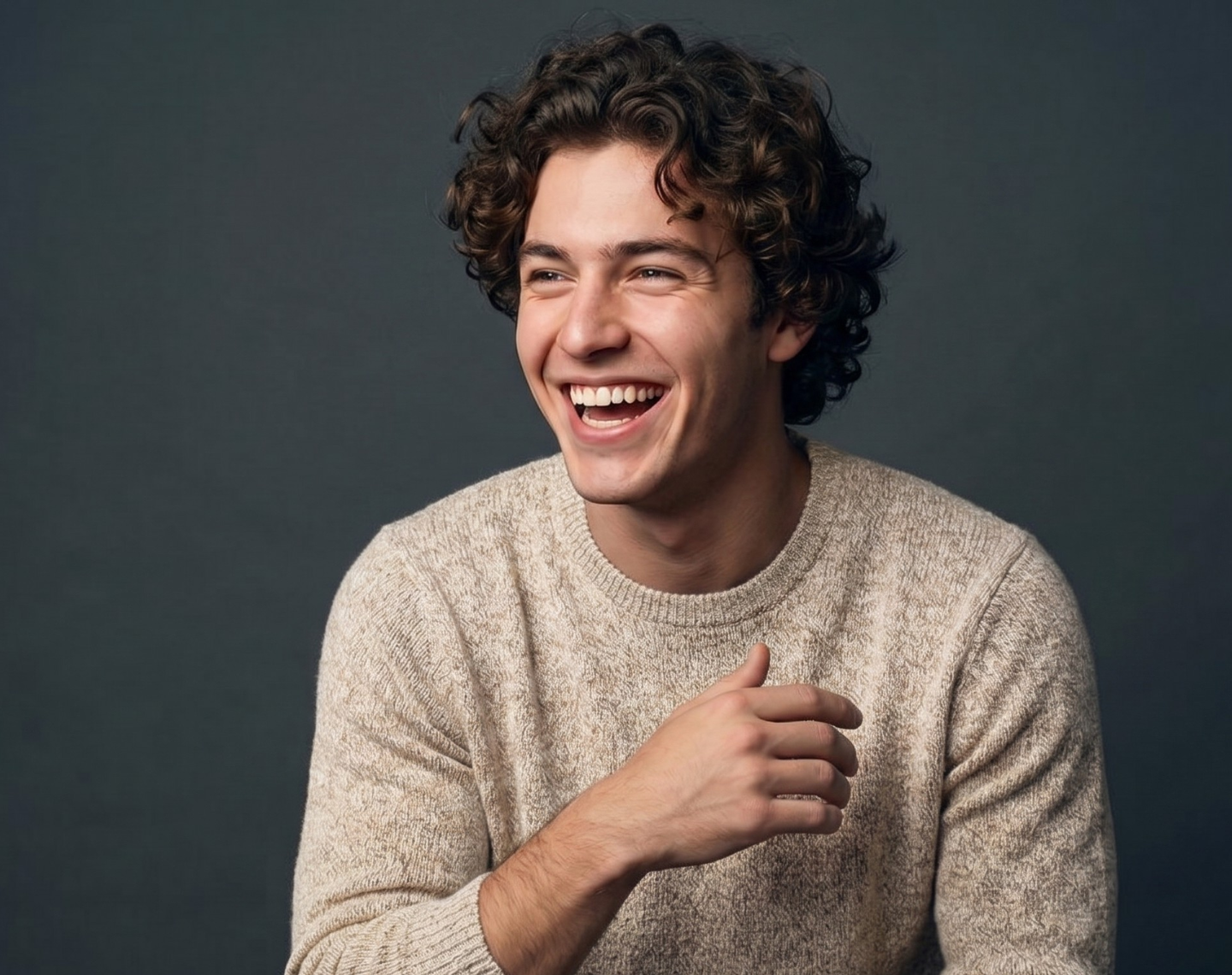 Smiling man with thick curly healthy hair representing Deoxylocks hair regrowth treatment for men with thinning hair and hair loss